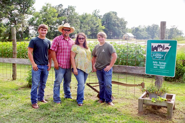 Alston family standing on farm photo